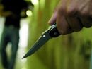 uomo armato di coltello